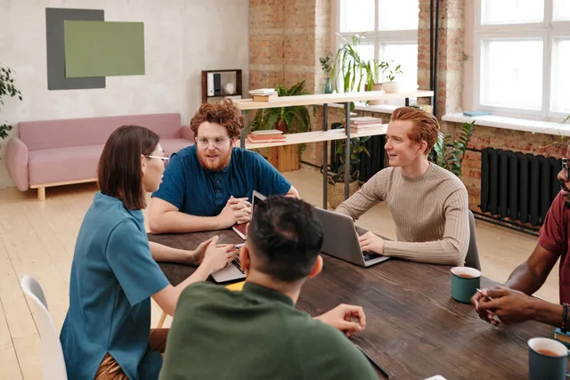 Professional team engaged in a collaborative work meeting in a modern office setting. A productivity software audience card: inclusion, exclusions, split test