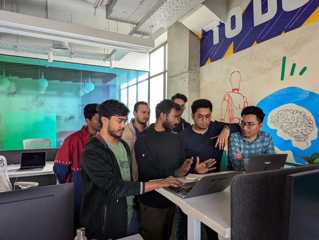 Young professionals collaborate around a laptop in a vibrant, modern office environment. GDPR compliant project management tools UK: which ones pass?